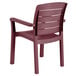 A red plastic Grosfillex Acadia Bordeaux armchair.