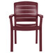 A case of 12 red Grosfillex Acadia Bordeaux stacking armchairs.