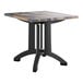 A Grosfillex square table with a wooden top.