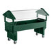 A Carlisle green food cart with a clear top on a counter.