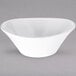 A white Carlisle melamine bowl on a gray background.