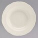 A white Homer Laughlin china bowl with a scalloped rim.