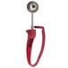 A Zeroll purple and silver ice cream scoop with a red handle.