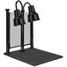 A black Hanson Heat Lamp carving station with two shades over a black stand.