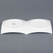 A white CAC China divided plate with two small bowls on it.