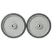 A pair of gray 10" wheels for a tilt truck with a rubber rim and a hole in the center.