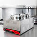 An Avantco countertop food warmer with two stainless steel containers and lids.