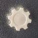 A white plastic gear-shaped knob labeled 'open' on a textured gray surface, likely part of a walk-in cooler.
