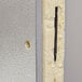 A close-up view of the cross-section of an insulated metal panel, likely part of a walk-in cooler wall.