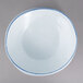 A white bowl with a blue rim.