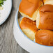 A bowl of bread rolls in a 10 Strawberry Street Arctic Blue porcelain bowl.