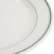 A Homer Laughlin ivory china plate with a green band on the edge.