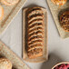 A table with a variety of baked goods on 10 Strawberry Street Tiger Eye rectangular porcelain platters.