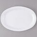 A white oval platter on a gray surface.
