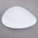 A white porcelain platter with a blue irregular rim.
