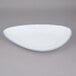 A white porcelain platter with an irregular blue rim.