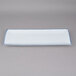 A rectangular white porcelain platter with a blue border.