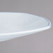 A white rectangular porcelain platter with a blue rim.