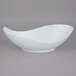 A white bowl with blue speckled design.