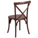 A Flash Furniture mahogany wooden chair with a cross back and cushion.