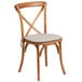 A Flash Furniture oak wood banquet chair with a cushion.