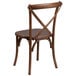 A Flash Furniture Pecan wood stackable cross back chair.