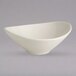 A white Homer Laughlin china bowl with a curved bottom.