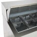 A Beverage-Air refrigerated sandwich prep table with clear containers inside metal containers.