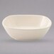 A white bowl with a small rim on a gray background.