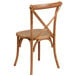 A Flash Furniture oak wood stackable cross back chair.