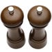 A Chef Specialties walnut pepper mill and salt mill set with silver tops and wooden handles.