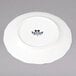 A white Tuxton TuxTrendz china plate with black text that says Charleston.