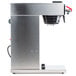 A silver Bunn airpot coffee maker with a black plastic container on a stainless steel base.