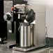 A Bunn coffee machine with a metal airpot on a counter.