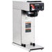 A silver Bunn airpot coffee brewer with black and red labels.