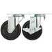 A pair of Avantco plate casters with black rubber wheels and metal mounts.