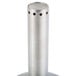 A Franmara stainless steel decanter funnel set on a table stand with a metal cylinder with holes.