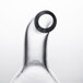 A clear glass tube with a black ring on top.