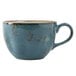 A Tuxton TuxTrendz Artisan Geode Azure round coffee cup with a handle and brown specks on the rim.