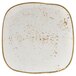 A white square Tuxton China plate with brown specks.