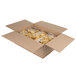 A cardboard box filled with bags of Martin's yellow round corn tortilla chips.