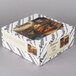 A white Pellman whole carrot cake box with a picture on it.