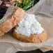 A sandwich with Spring Glen Fresh Foods Chunky White Chicken Salad on top of it.