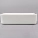 An Arcoroc white rectangular bowl on a white surface.