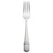 A Oneida stainless steel dinner fork with a silver handle and plate.