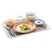 A bowl of food with a fork on a table