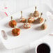 A white plate with Fontanini Mamma Ranne Italian style beef and pork meatballs.