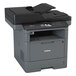 A close-up of a black and grey Brother MFC-L5900DW monochrome laser printer.