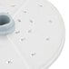 A white circular Robot Coupe grating / shredding disc with holes in it.