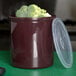 A brown Carlisle crock lid with broccoli inside.